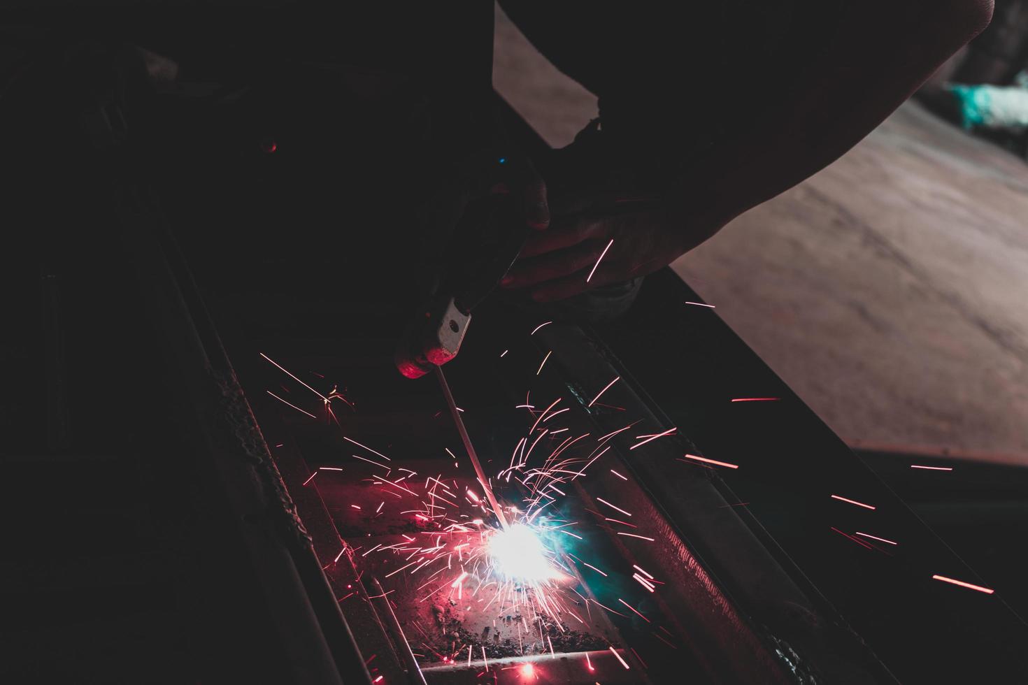 welder, welding automotive part in a car factory photo