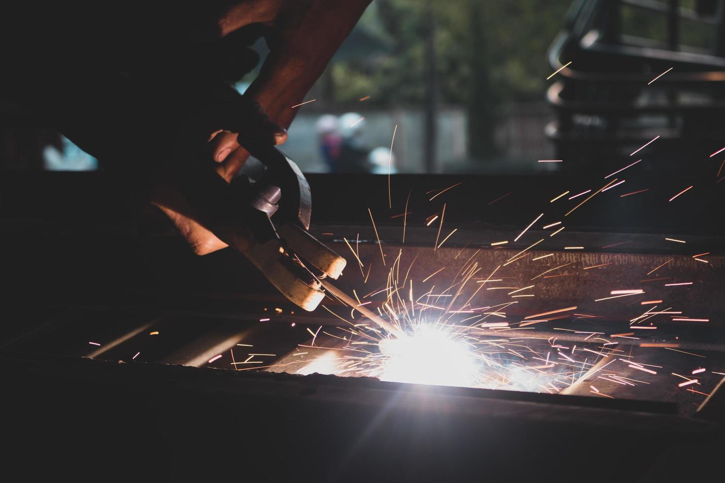 welder, welding automotive part in a car factory photo