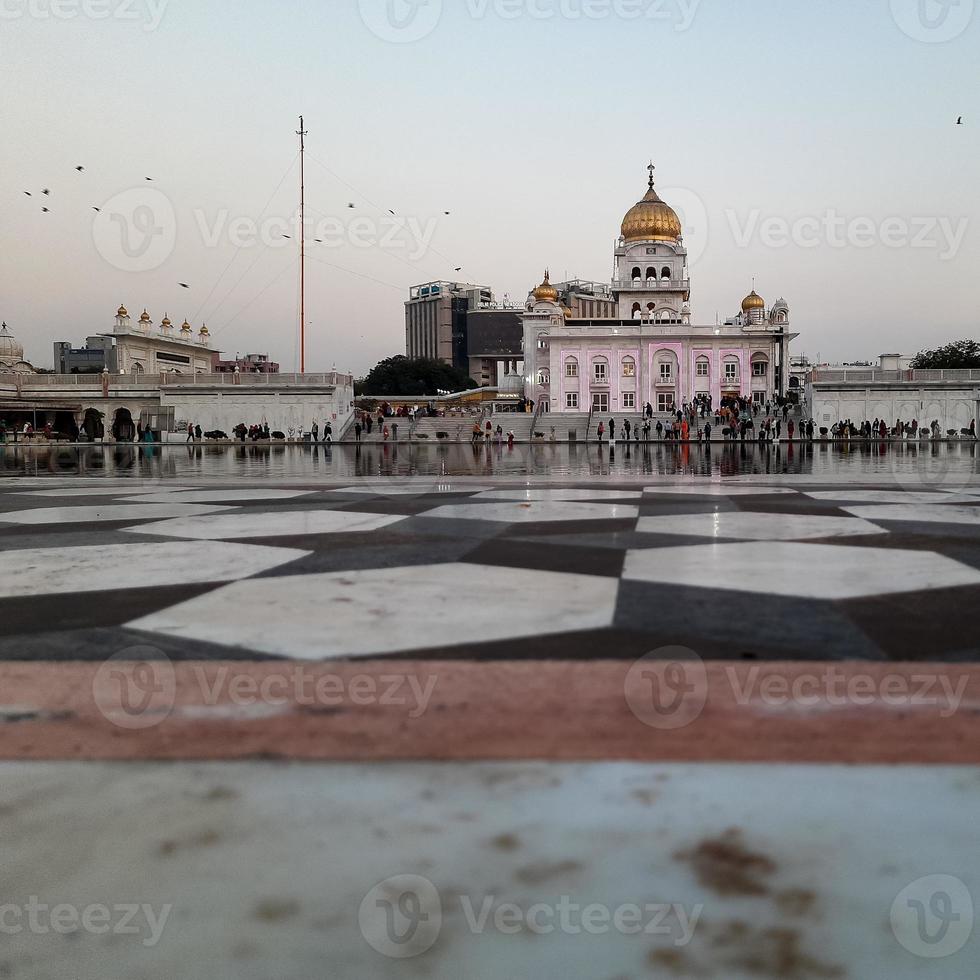 Gurdwara Bangla Sahib is the most prominent Sikh Gurudwara, Bangla Sahib Gurudwara inside view during evening time in New Delhi, India, Sikh Community one of the famous gurudwara Bangla Sahib view photo