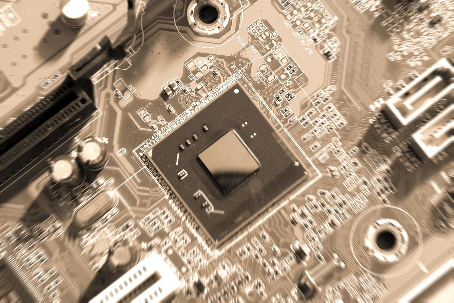 Electronic circuit boards on brown background, selective focus photo