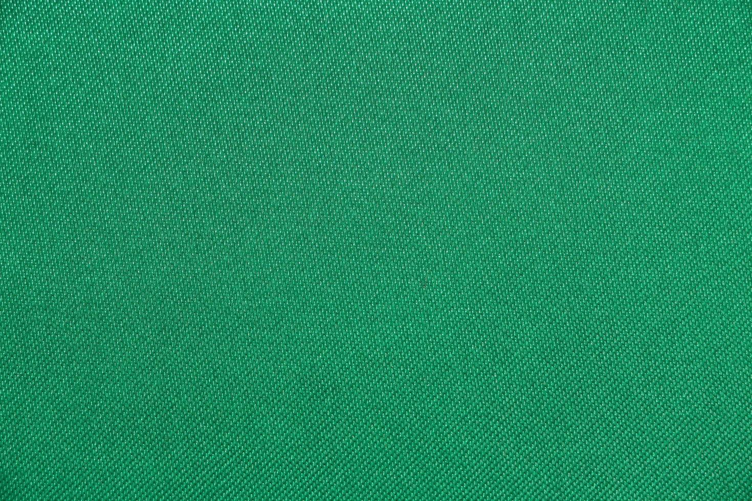 Texture of fabric green color has smooth surface, abstract background. photo