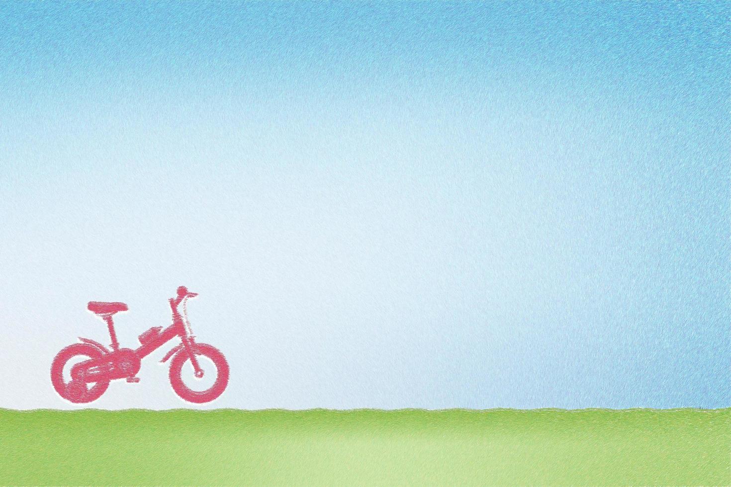 Drawing chalk of kid bicycle with blue sky background photo