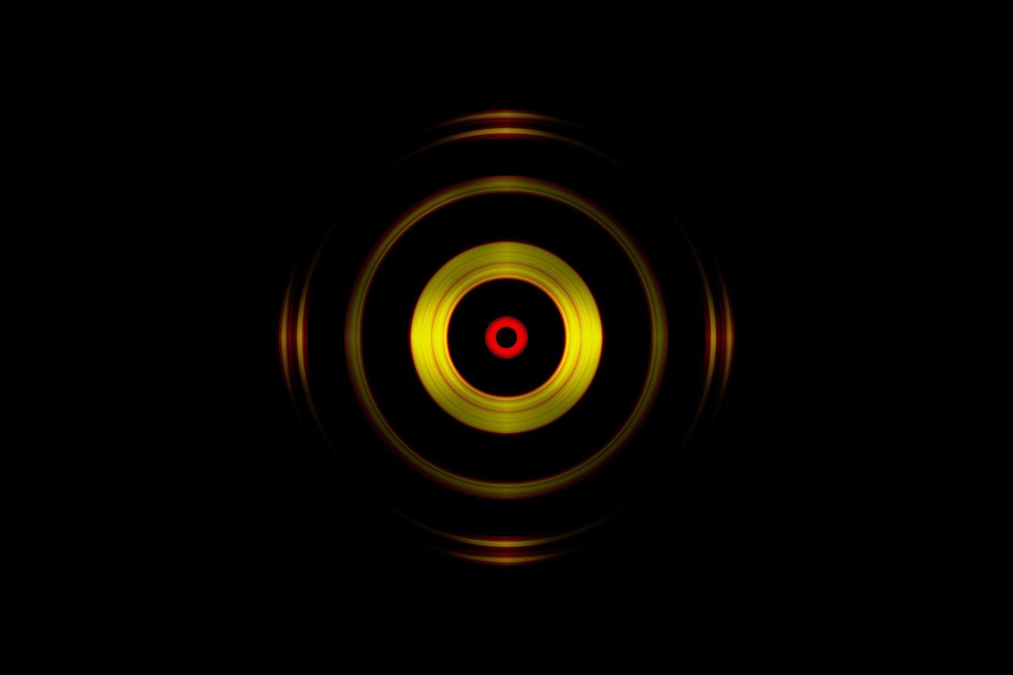 Abstract orange eye effect with photo lens on black background