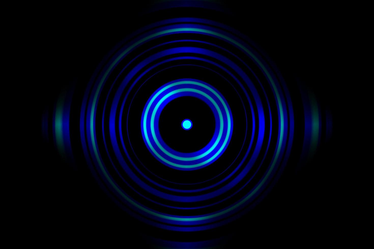 Sound waves oscillating blue light with circle spin abstract background photo