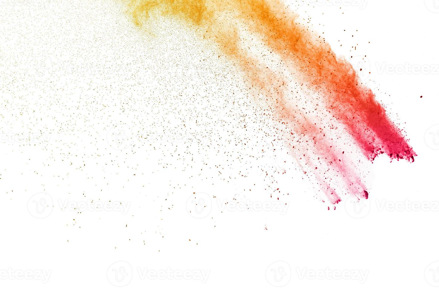 The explosion of colored powder. Red orange powder fly away. The cloud of glowing color powder  background photo
