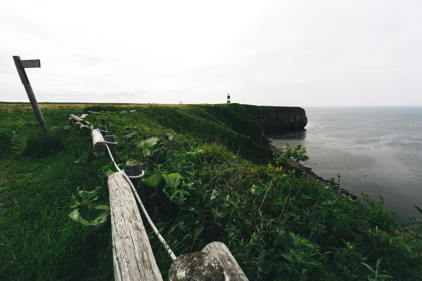 Notoro cape wide area meadow and lighthouse. Abashiri city, Hokkaido, Japan. photo