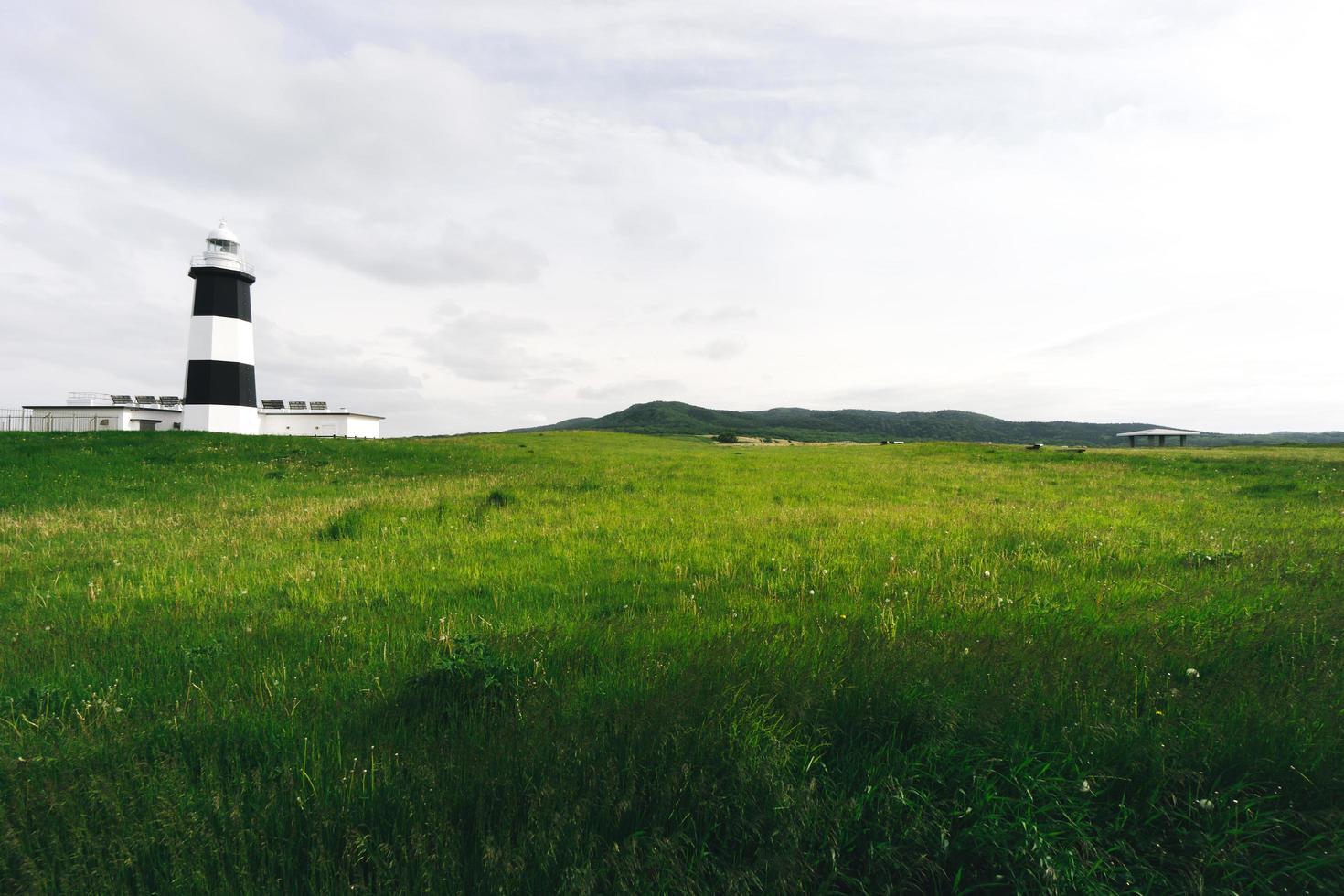 Notoro cape wide area meadow and lighthouse. Abashiri city, Hokkaido, Japan. photo