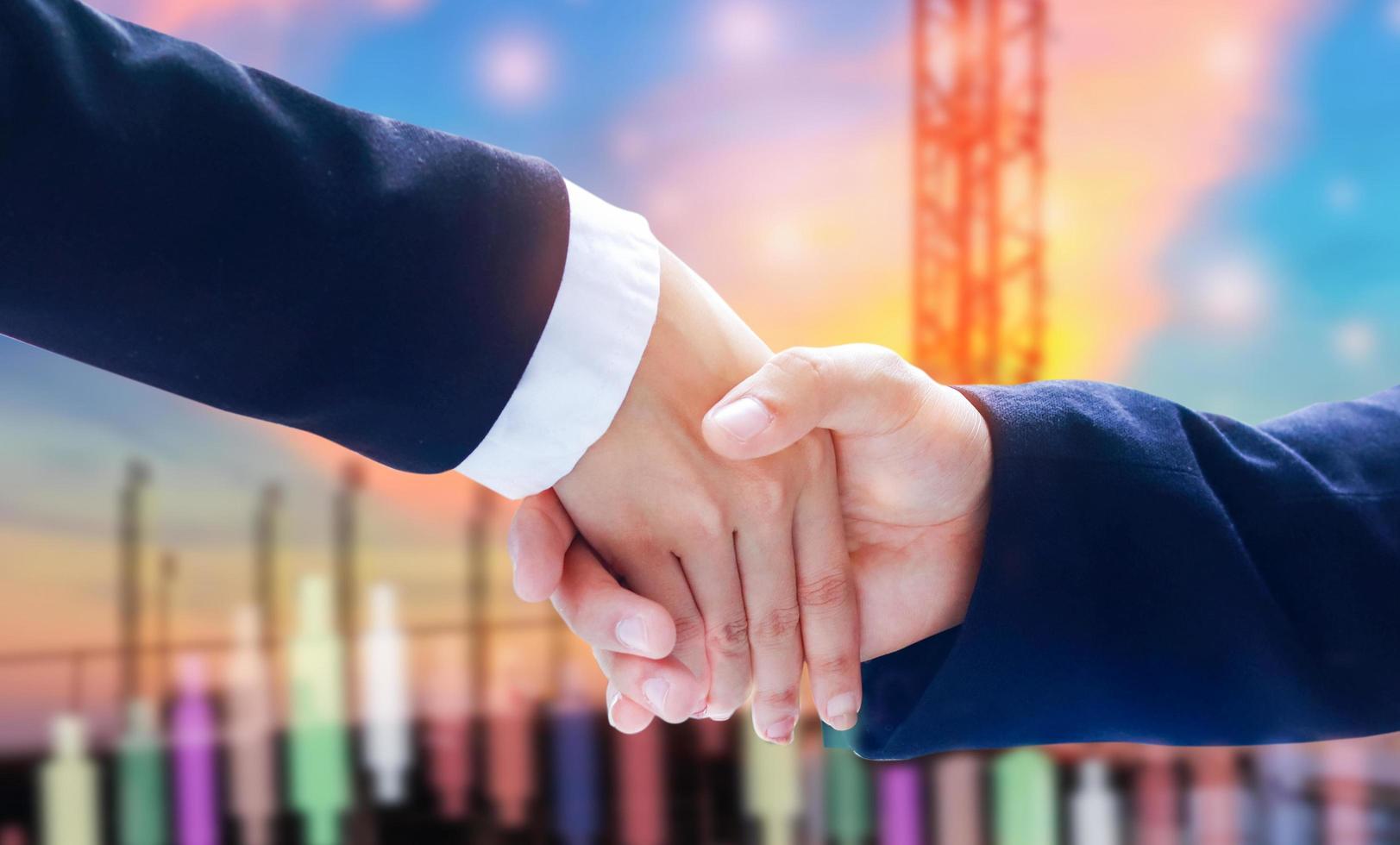 Businessmen shaking hands to sign agreement and business cooperation photo