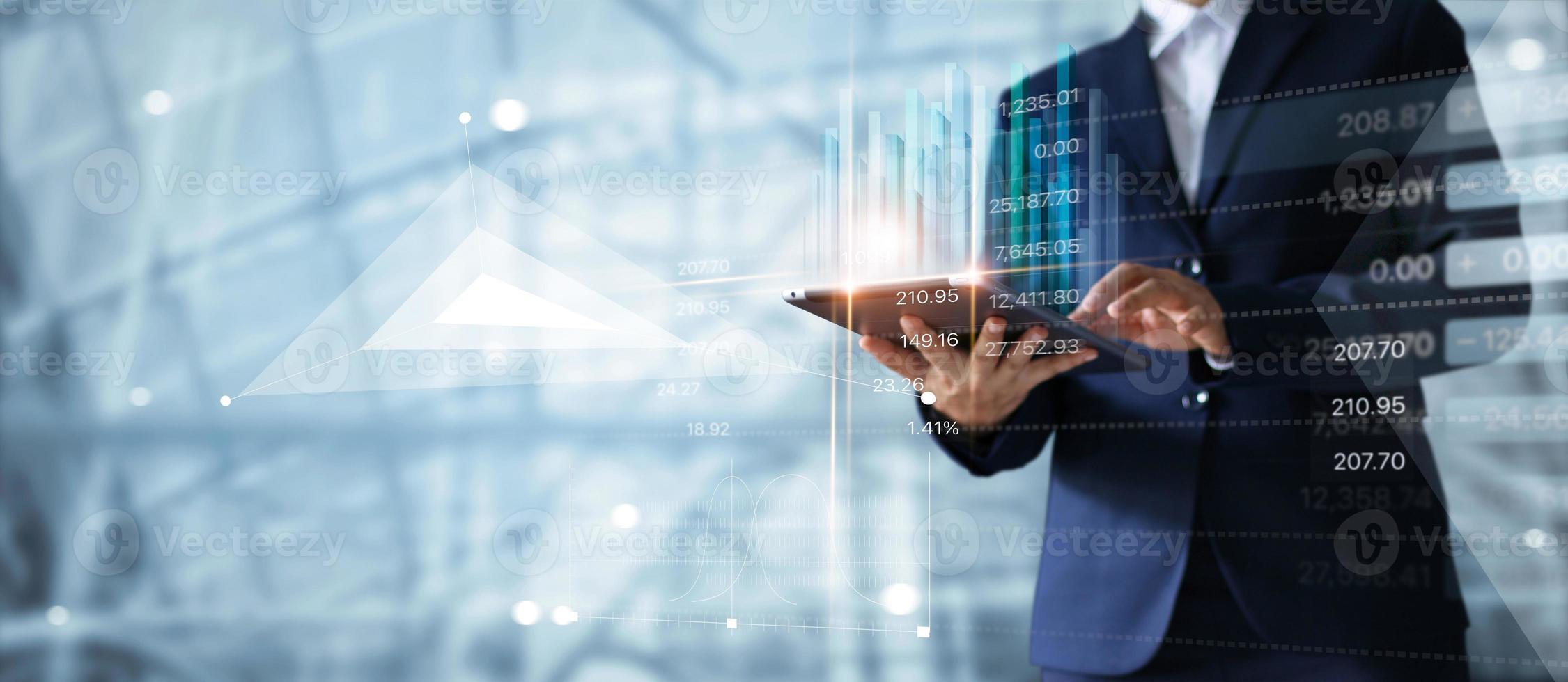 Businessman using tablet analyzing sales data and economic growth graph chart.  Business strategy. Abstract icon. Digital marketing photo