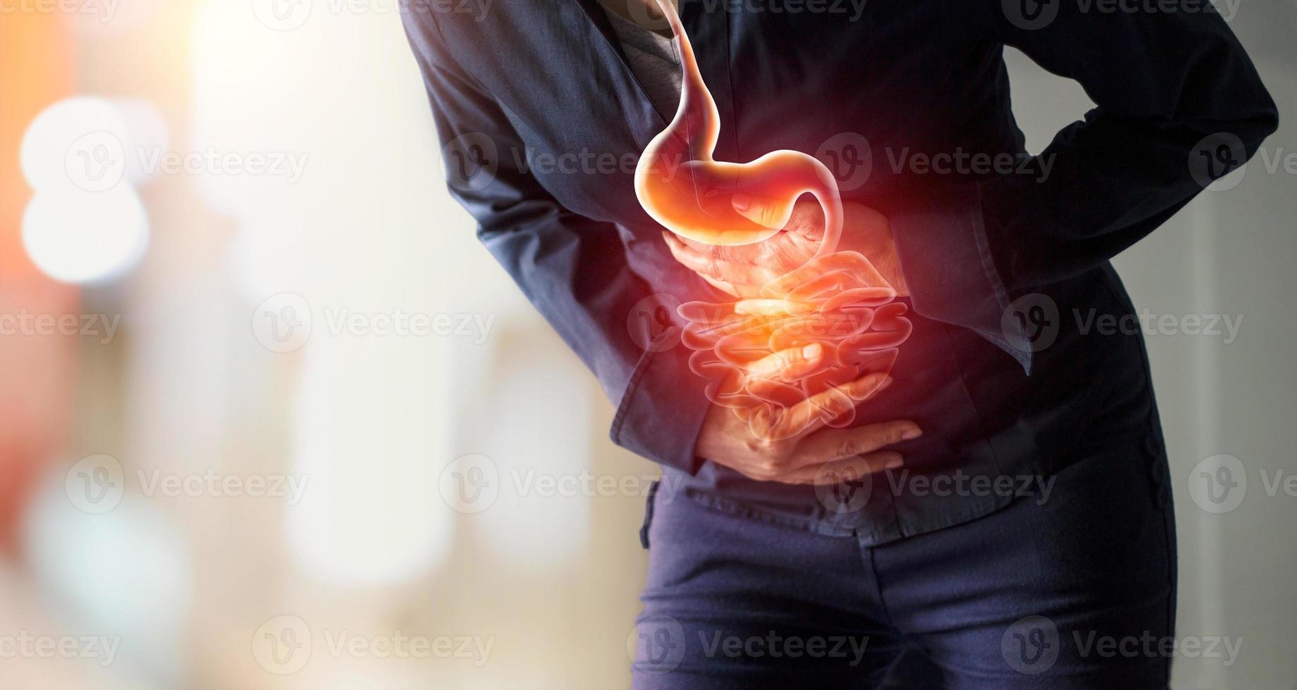 Woman touching stomach painful suffering from stomachache causes of menstruation period, gastric ulcer, appendicitis or gastrointestinal system desease. Healthcare and health insurance concept photo
