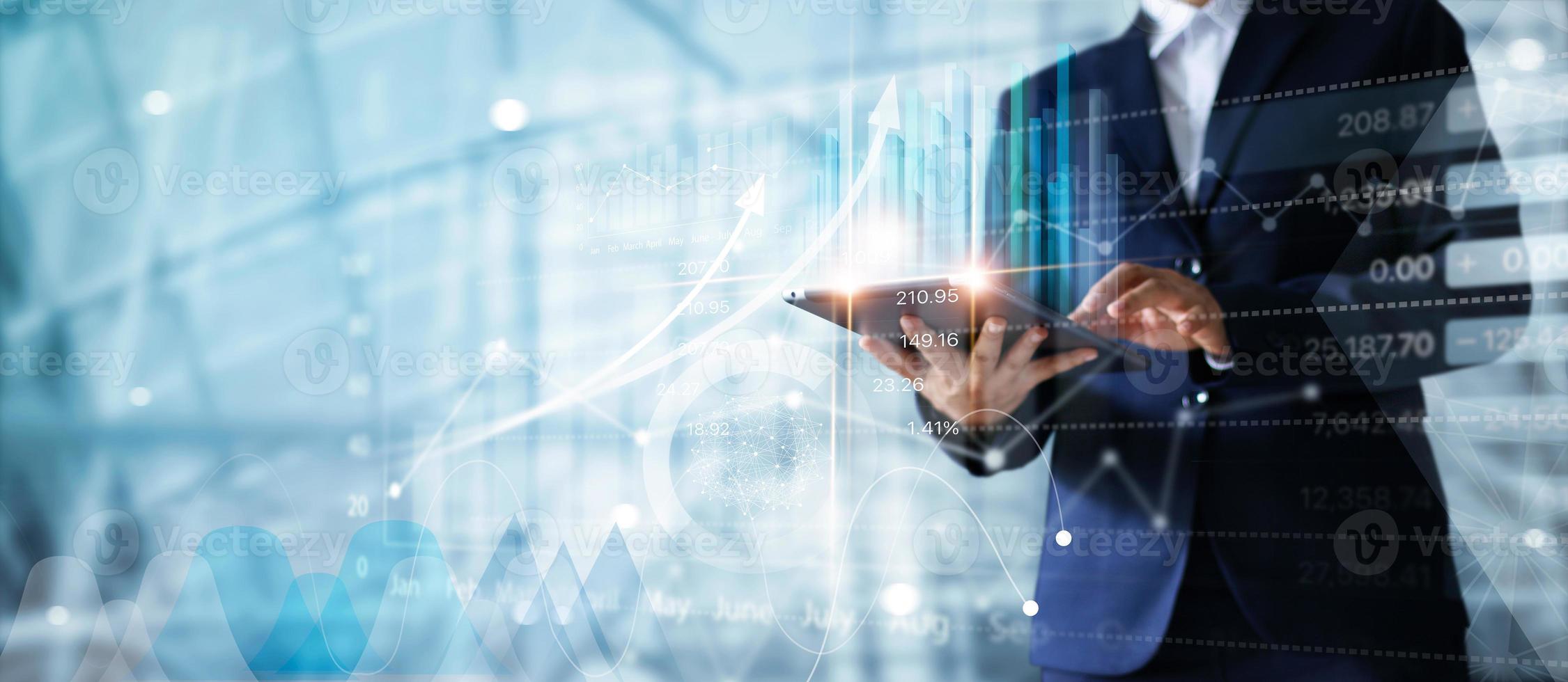 Businessman using tablet analyzing sales sdata and economic growth graph chart.  Buiness strategy. Abstract icon. Digital marketing. photo