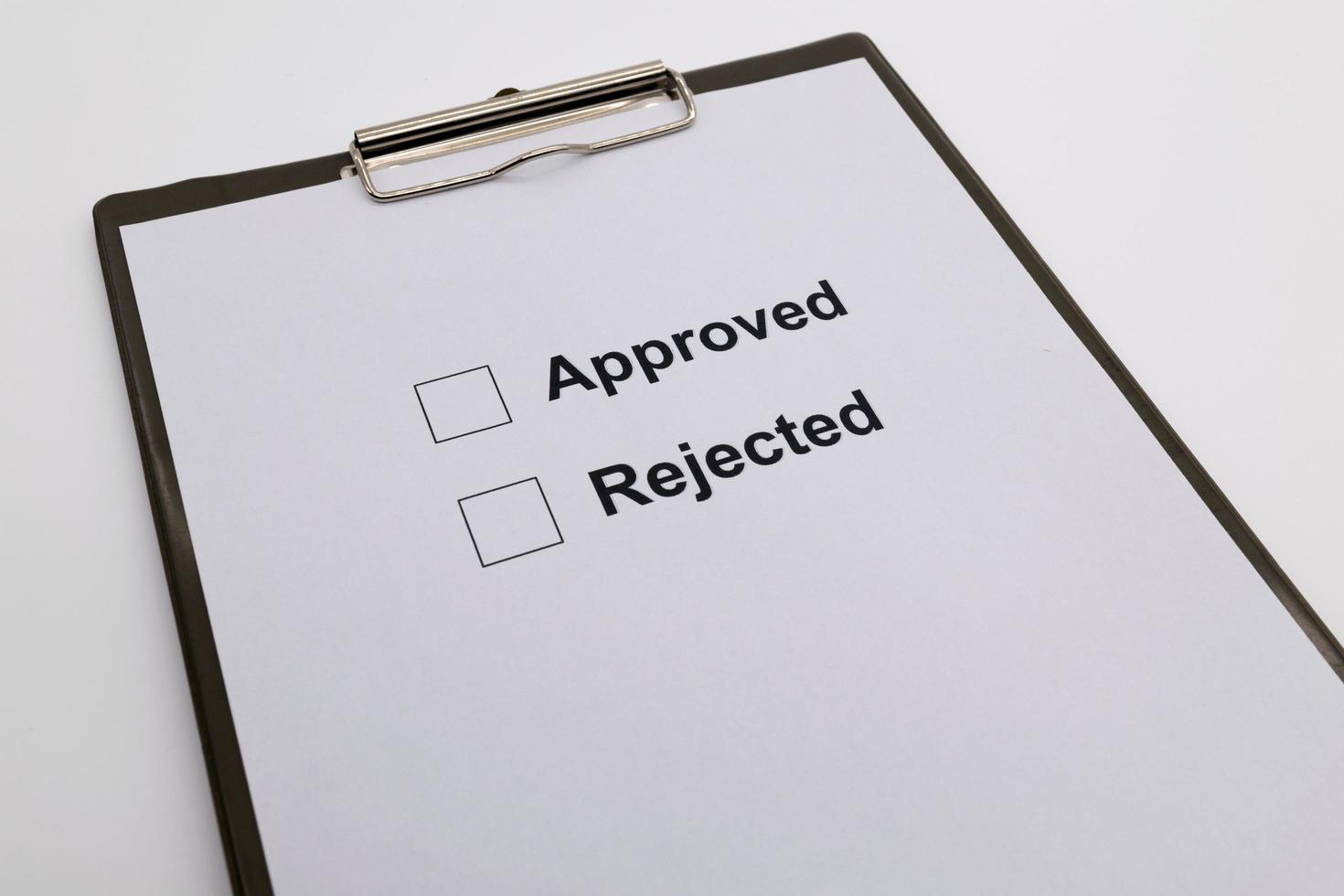 pen over document, select Approved or Rejected. photo