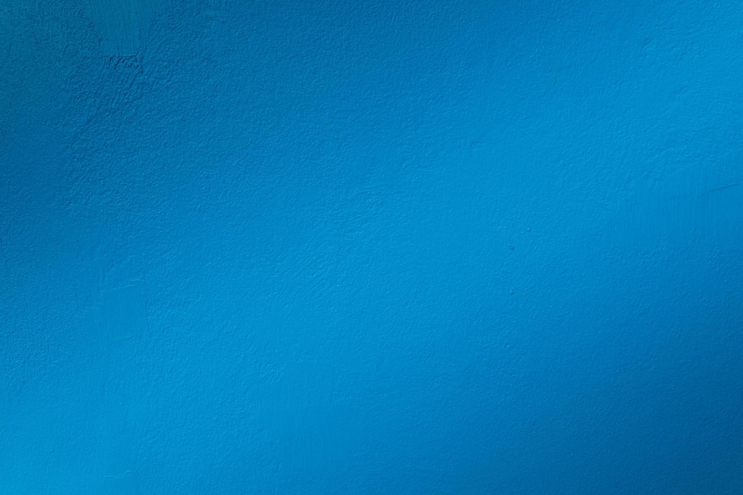Grain blue paint wall background or texture photo