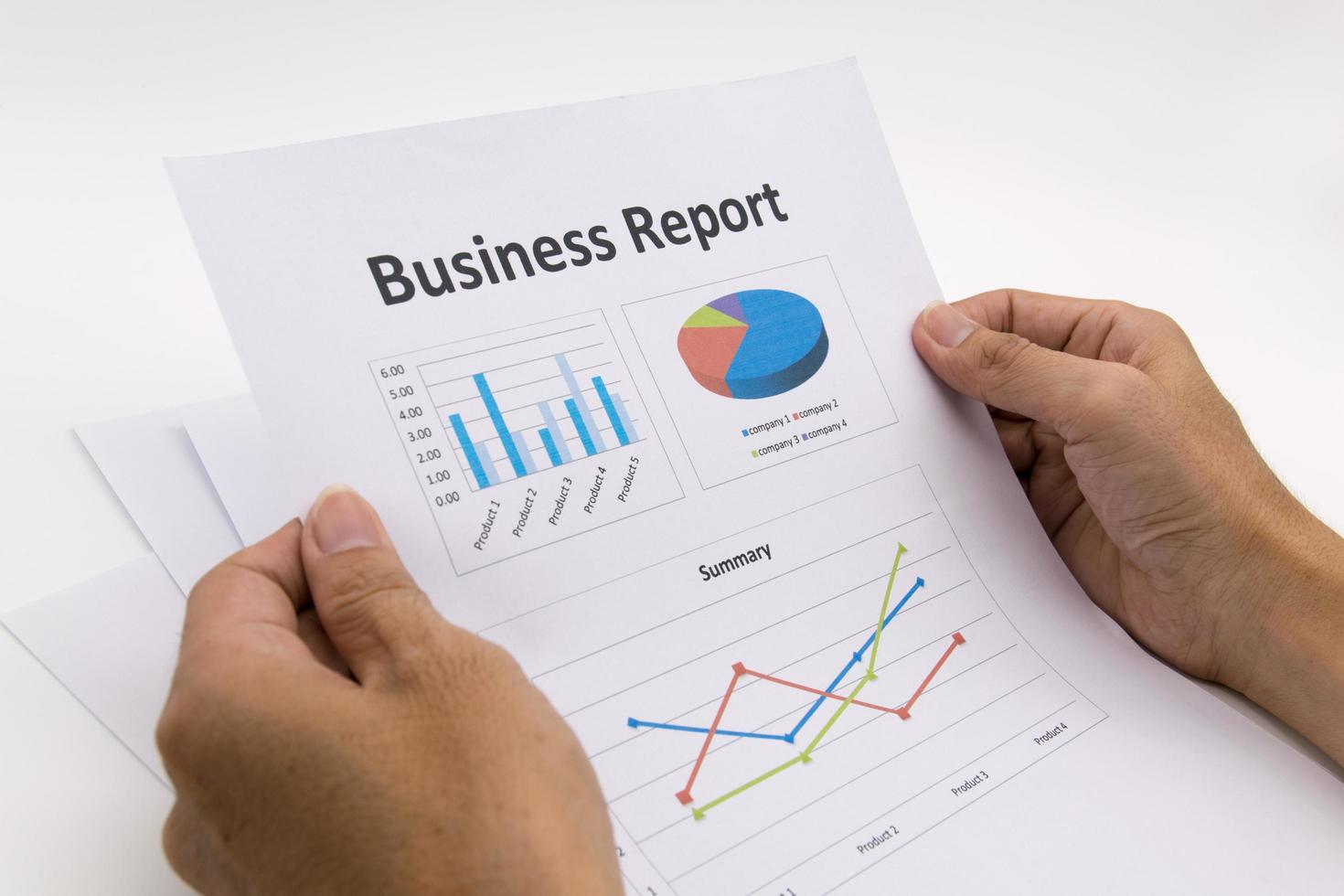 business report and man hand. photo