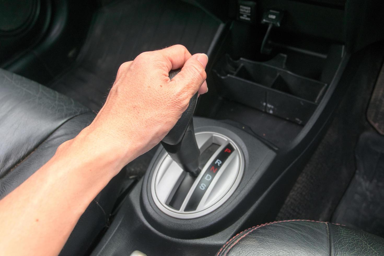 hand on automatic gear shift photo