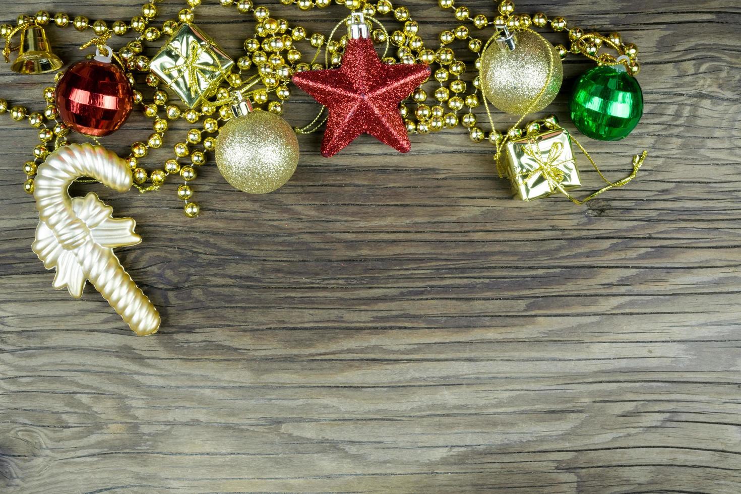 Christmas decorations on old wooden background. photo