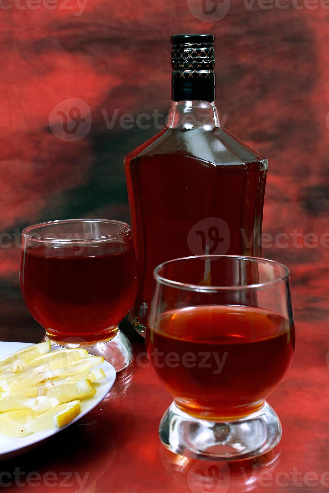 lemon alcohol drink is in a bottle and glass 7020480 Stock Photo at