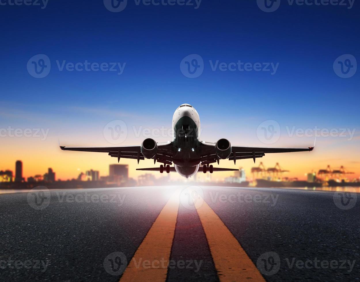 cargo plane take off from airport runways against ship port background use for air transportation and cargo logistic industry ,import ,export business photo