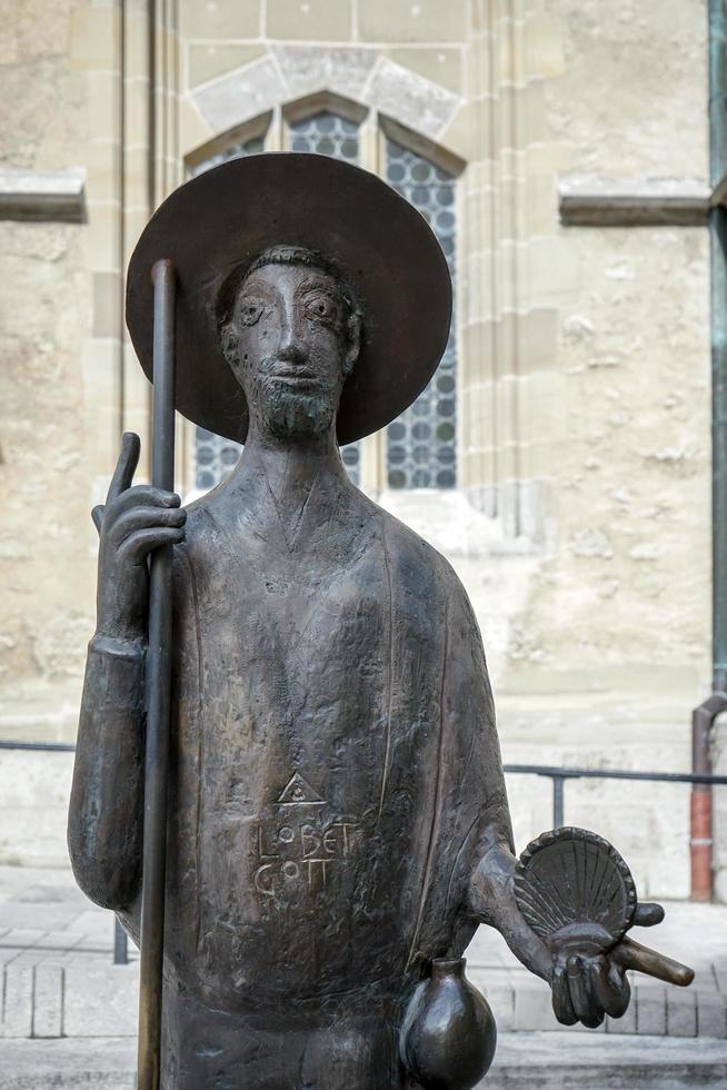 Rothenburg ob der Tauber, Northern Bavaria, Germany, 2014. Statue of a Man outside St James Church photo