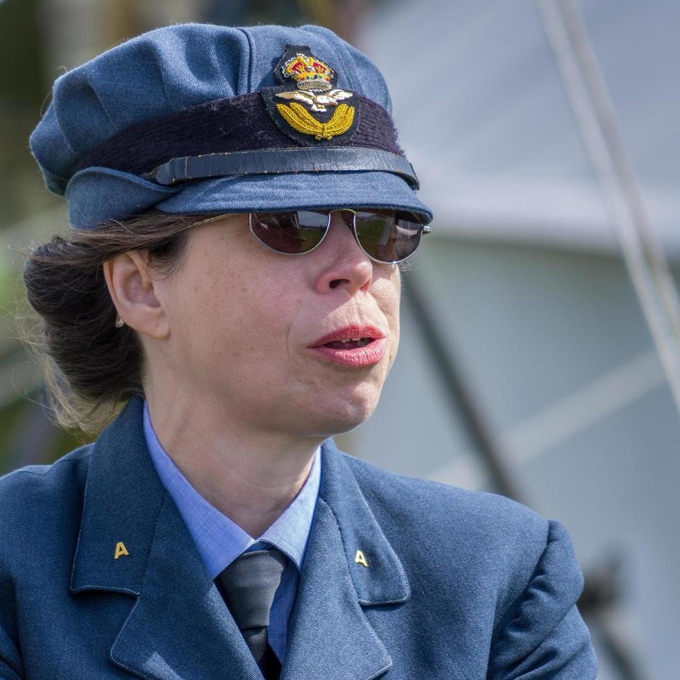 SHOREHAM-BY-SEA, WEST SUSSEX, UK, 2014.  - Woman dressed in WRAF uniform at the airshow in Shoreham photo