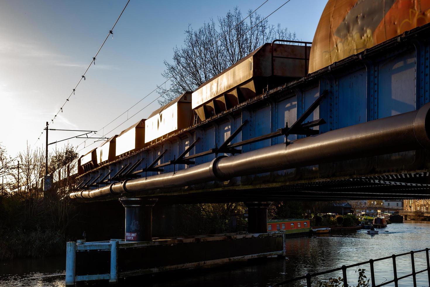 ELY, CAMBRIDGESHIRE, UK, 2012. Goods train pulling out of Ely in the evening sunshine photo