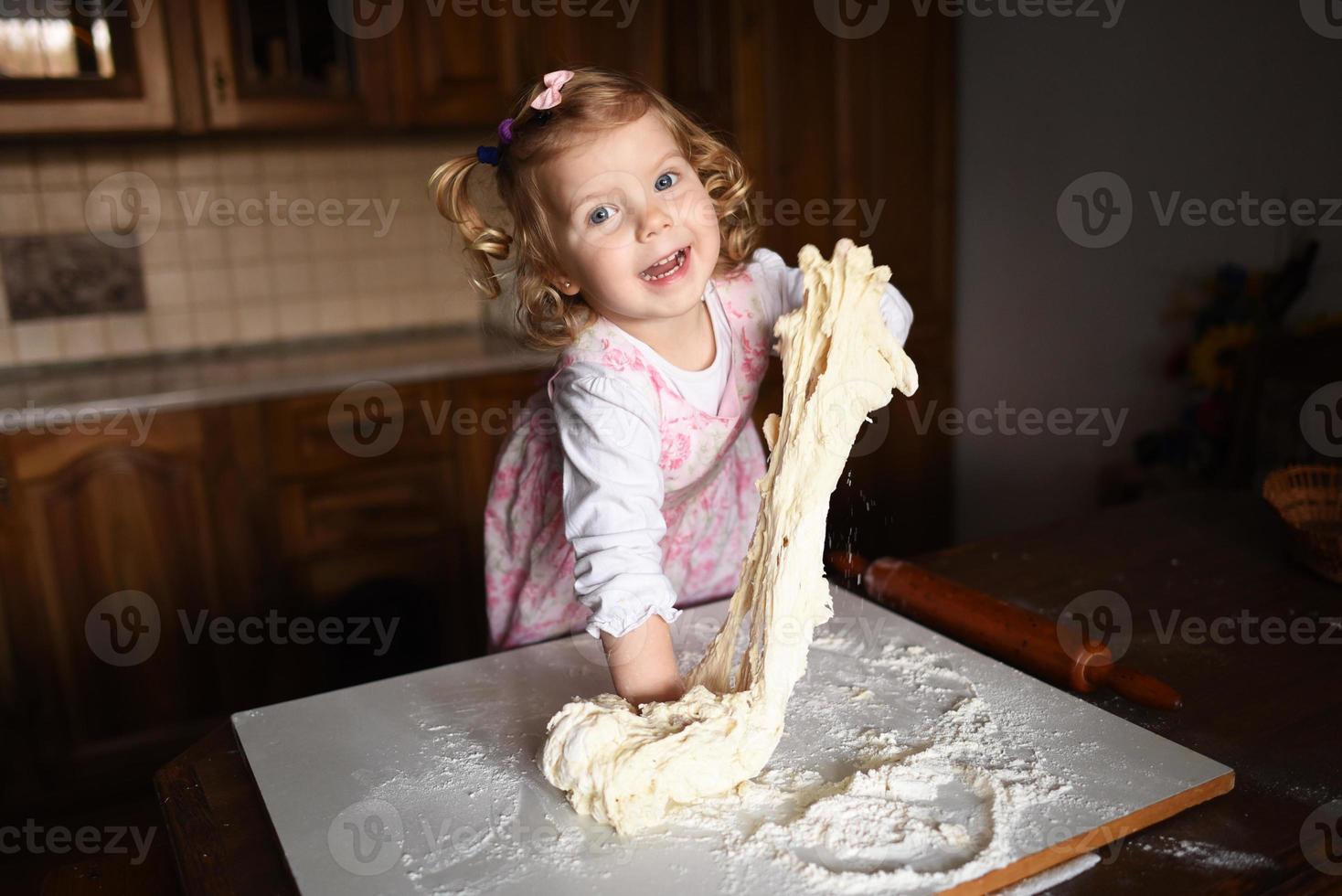 child preparing dough photo