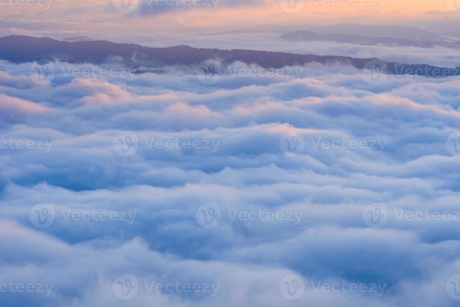 Cumulus fantastic fog in the morning sky photo