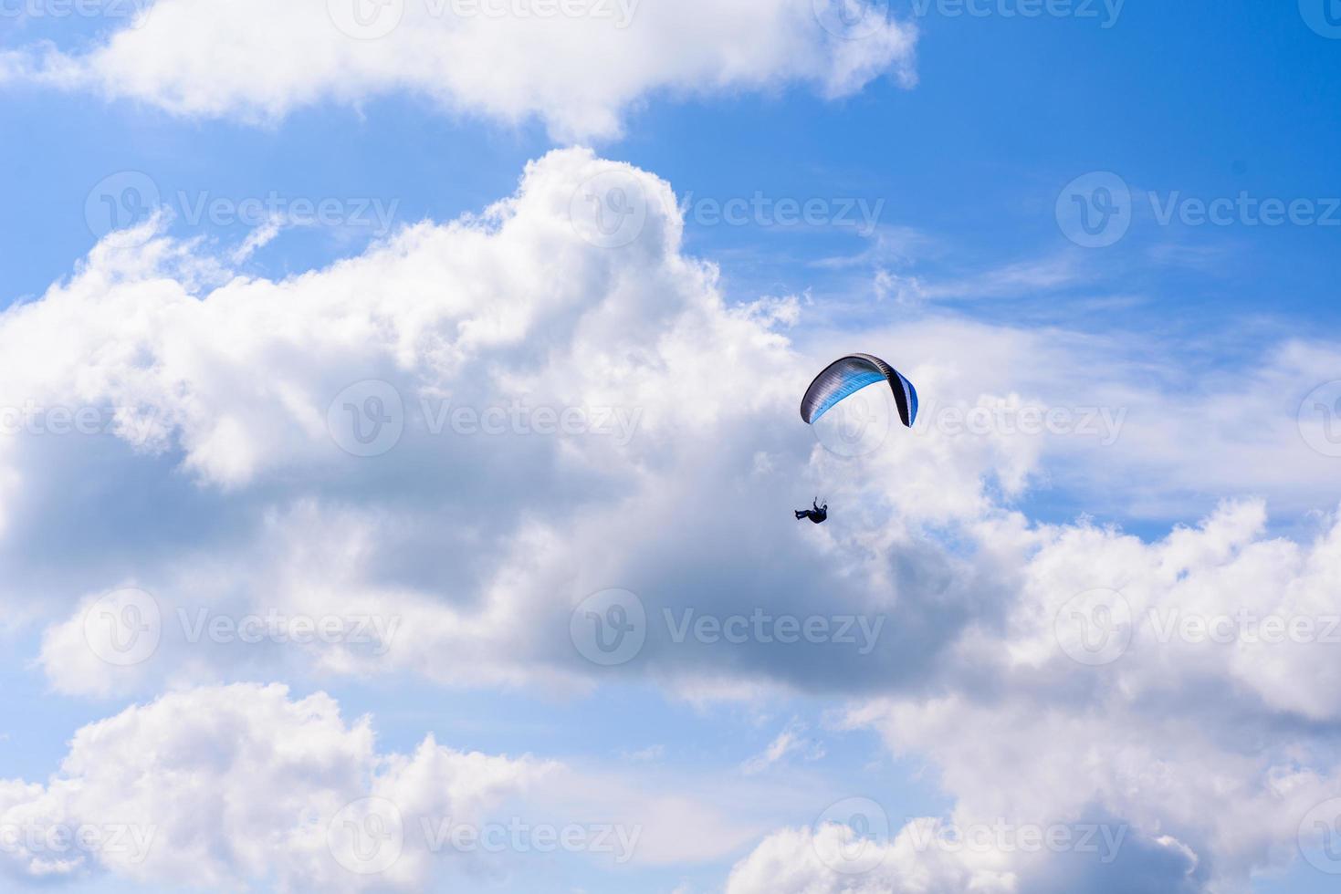 Skydiver in the clear sky photo