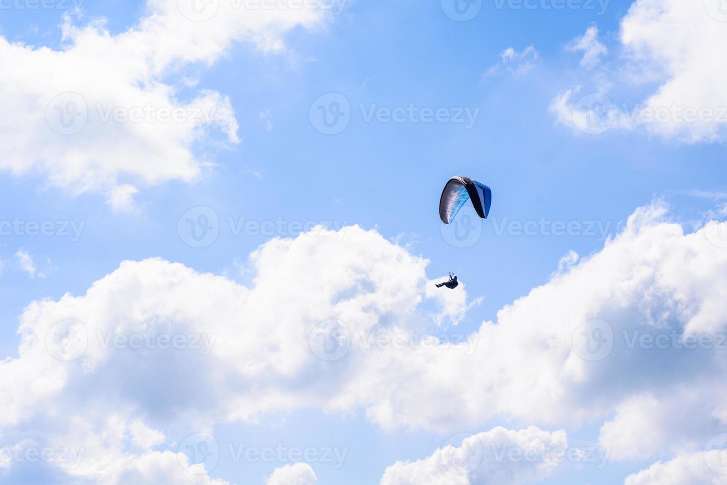 Skydiver in the clear sky photo