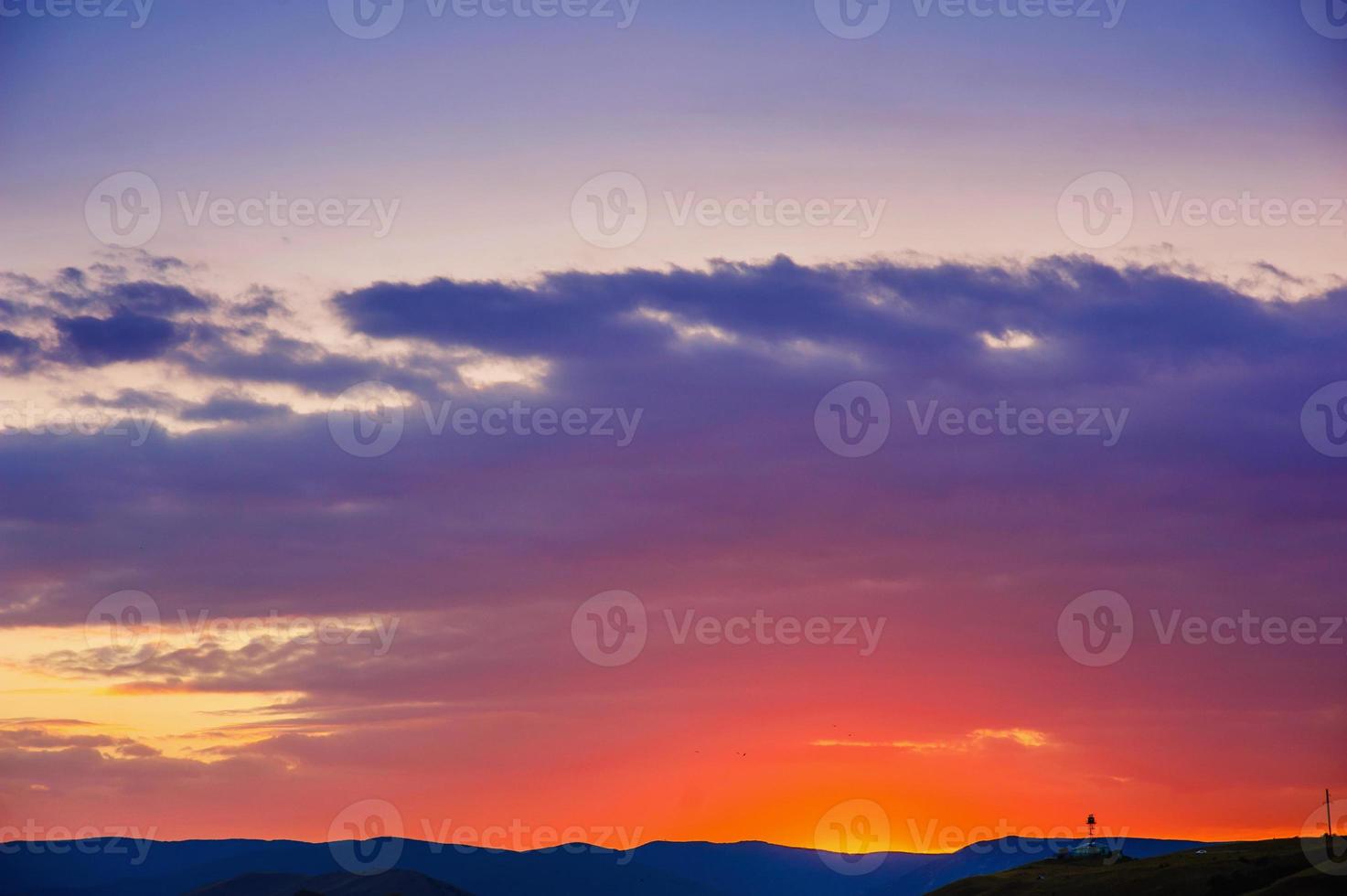 Colorful sunset over the mountain hills photo