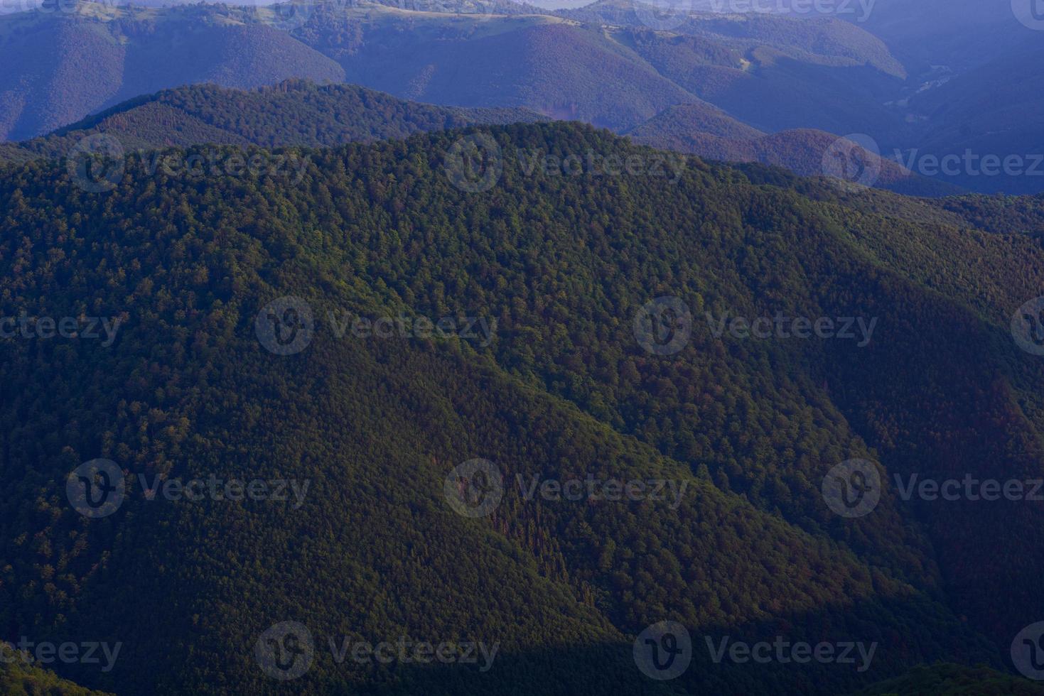 View of misty mountains in autumn photo