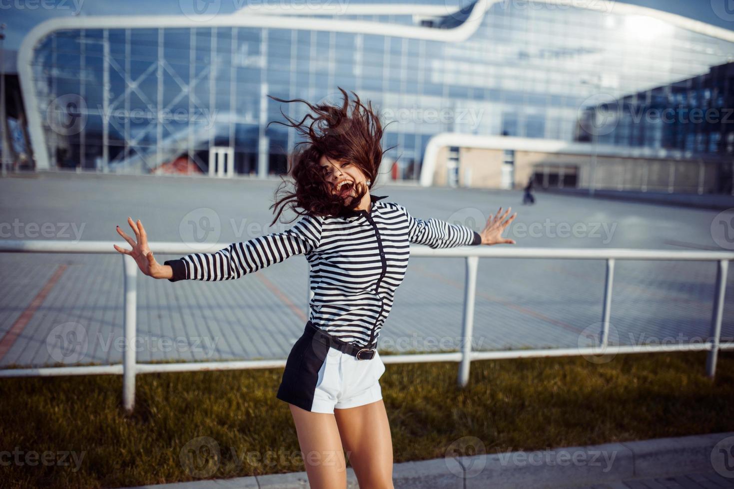 young carefree woman jumping photo
