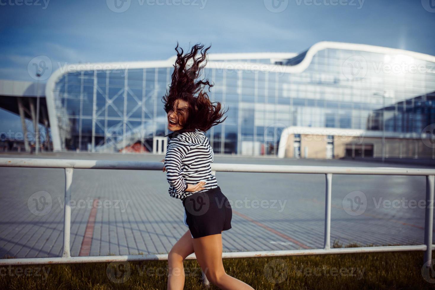 young carefree woman jumping photo