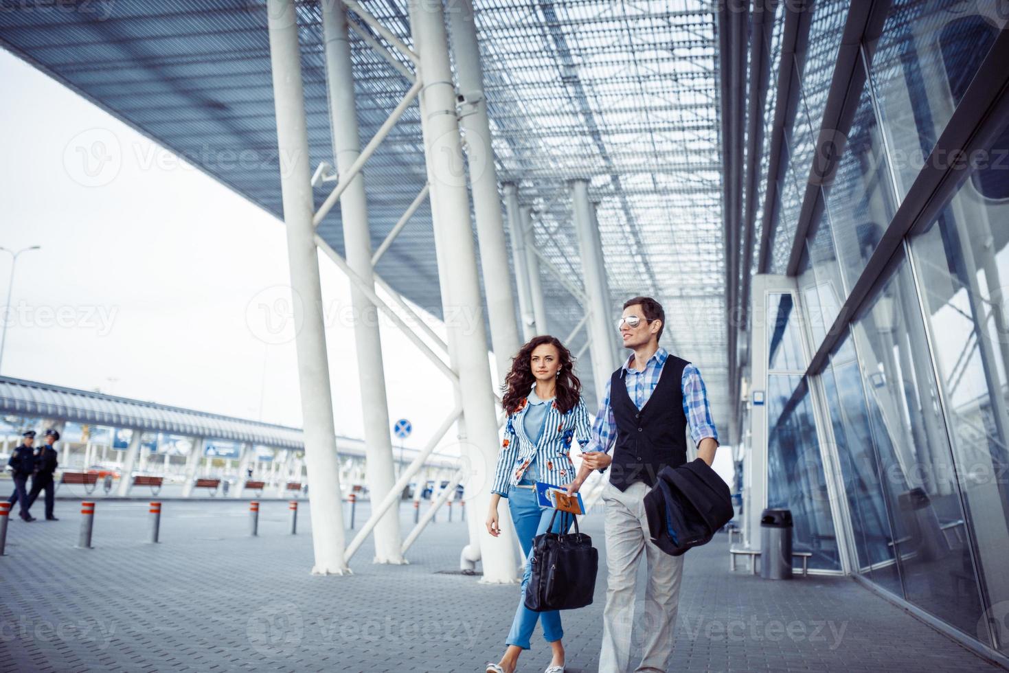 Two happy people at the airport photo