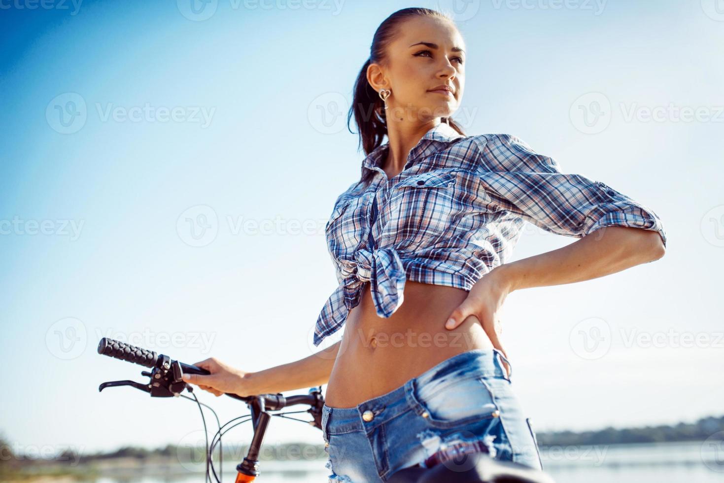 woman on a bicycle in beach photo