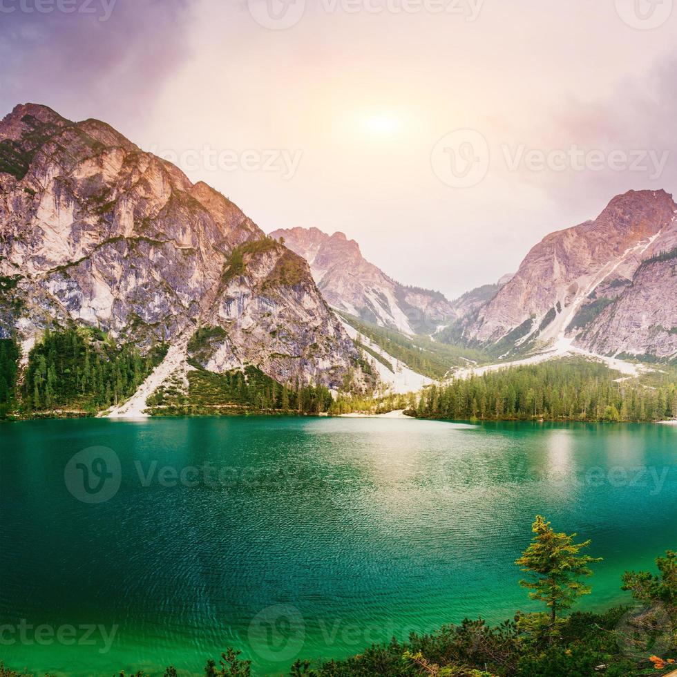 Mountain lake between by mountains photo