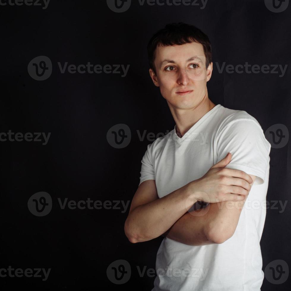 Beautiful young man in white shirt photo