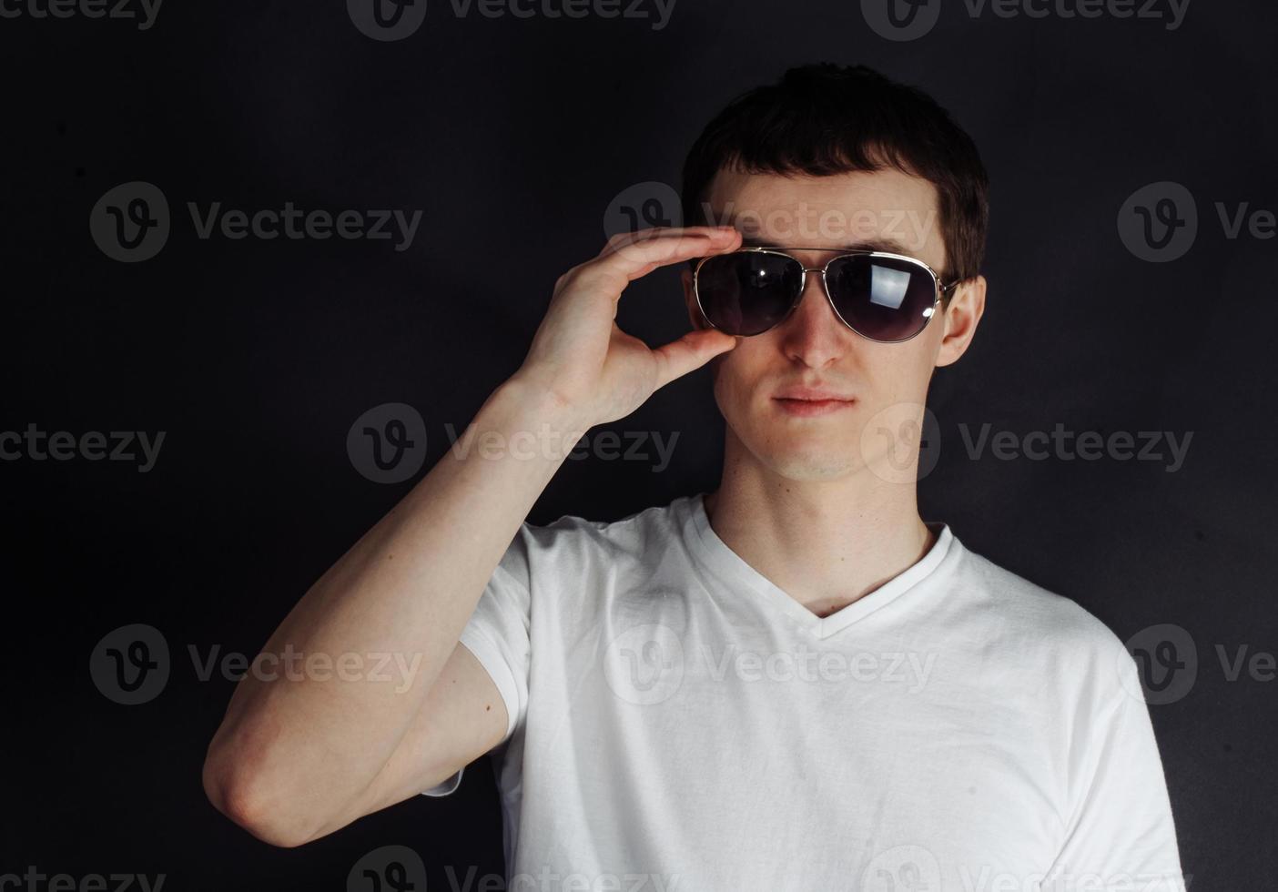 Handsome young man with eyeglasses photo