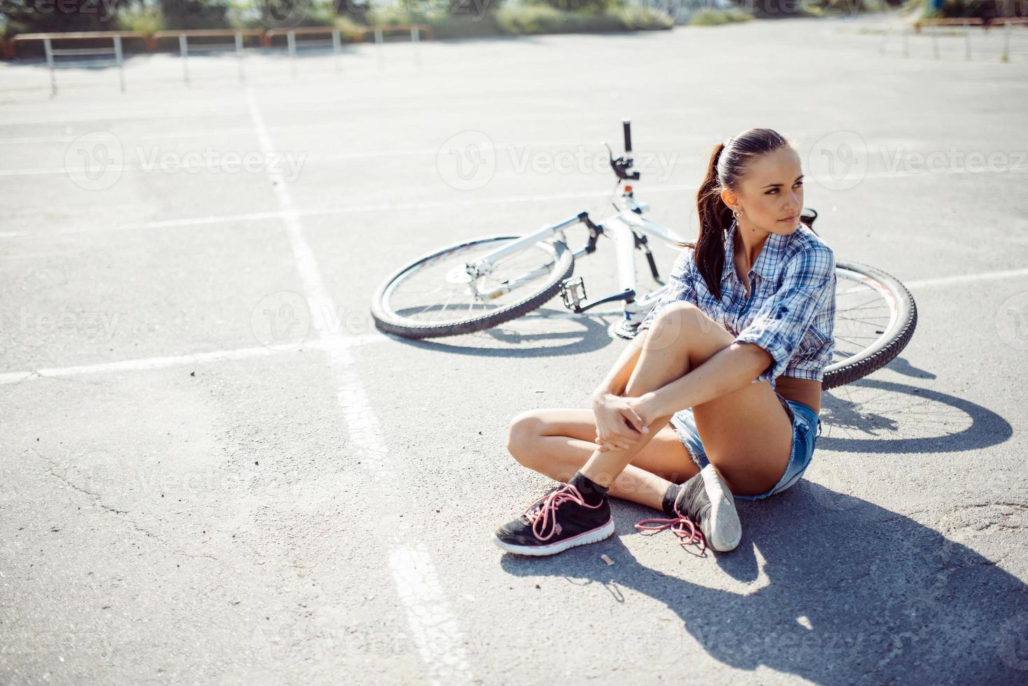 woman on a bicycle in beach photo