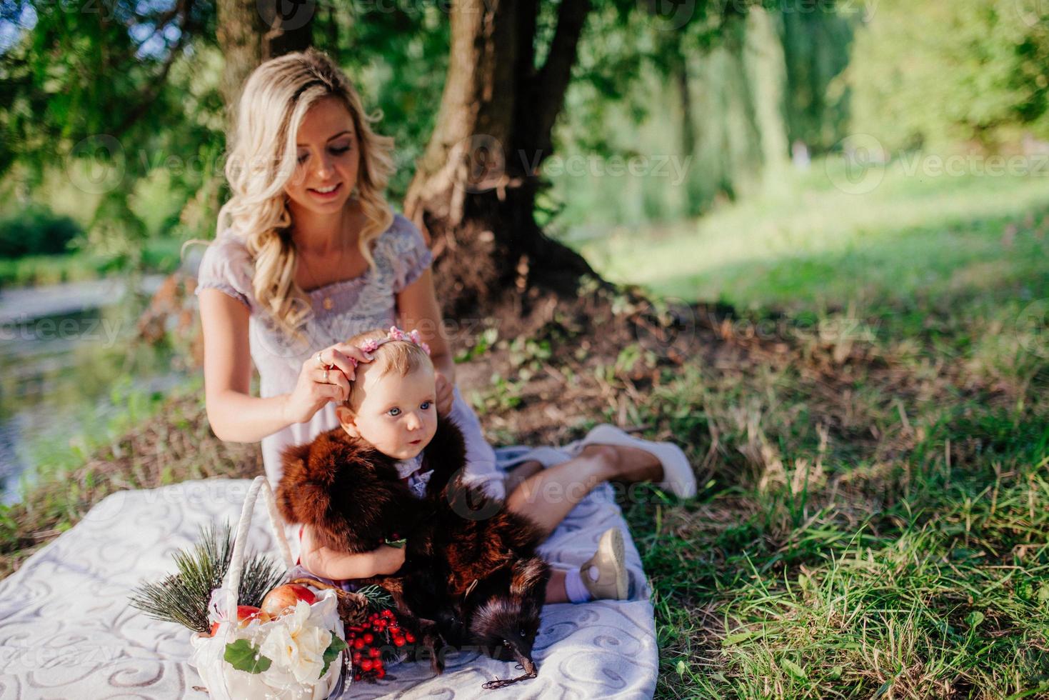 woman with a child on a walk on a sunny day photo