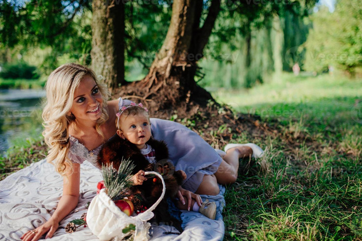 woman with a child on a walk on a sunny day photo