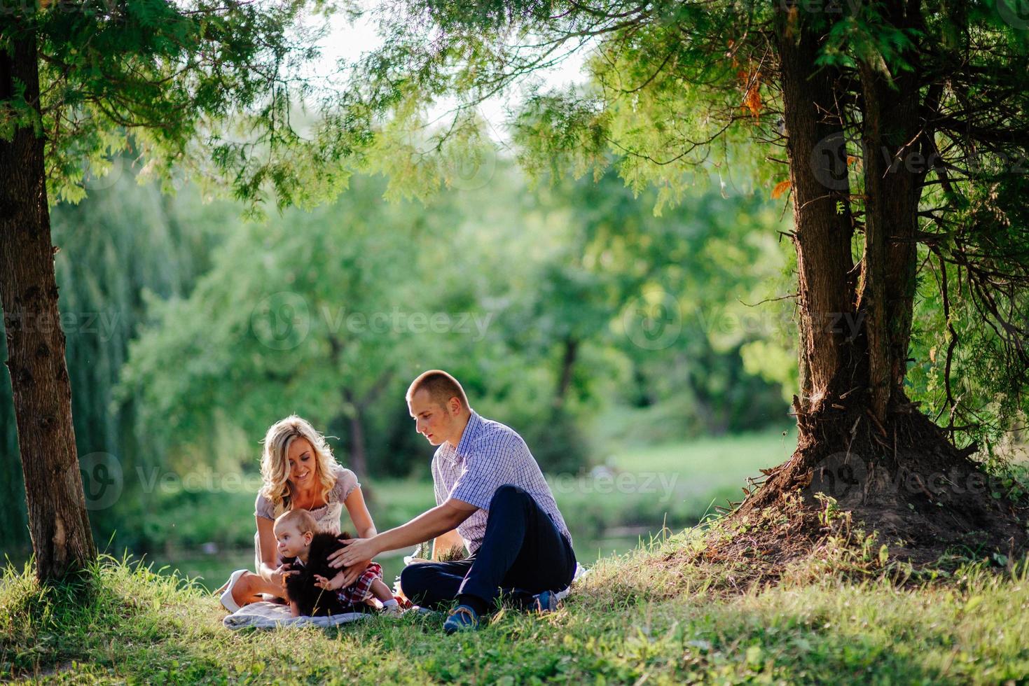 happy family are walking in the green summer park photo