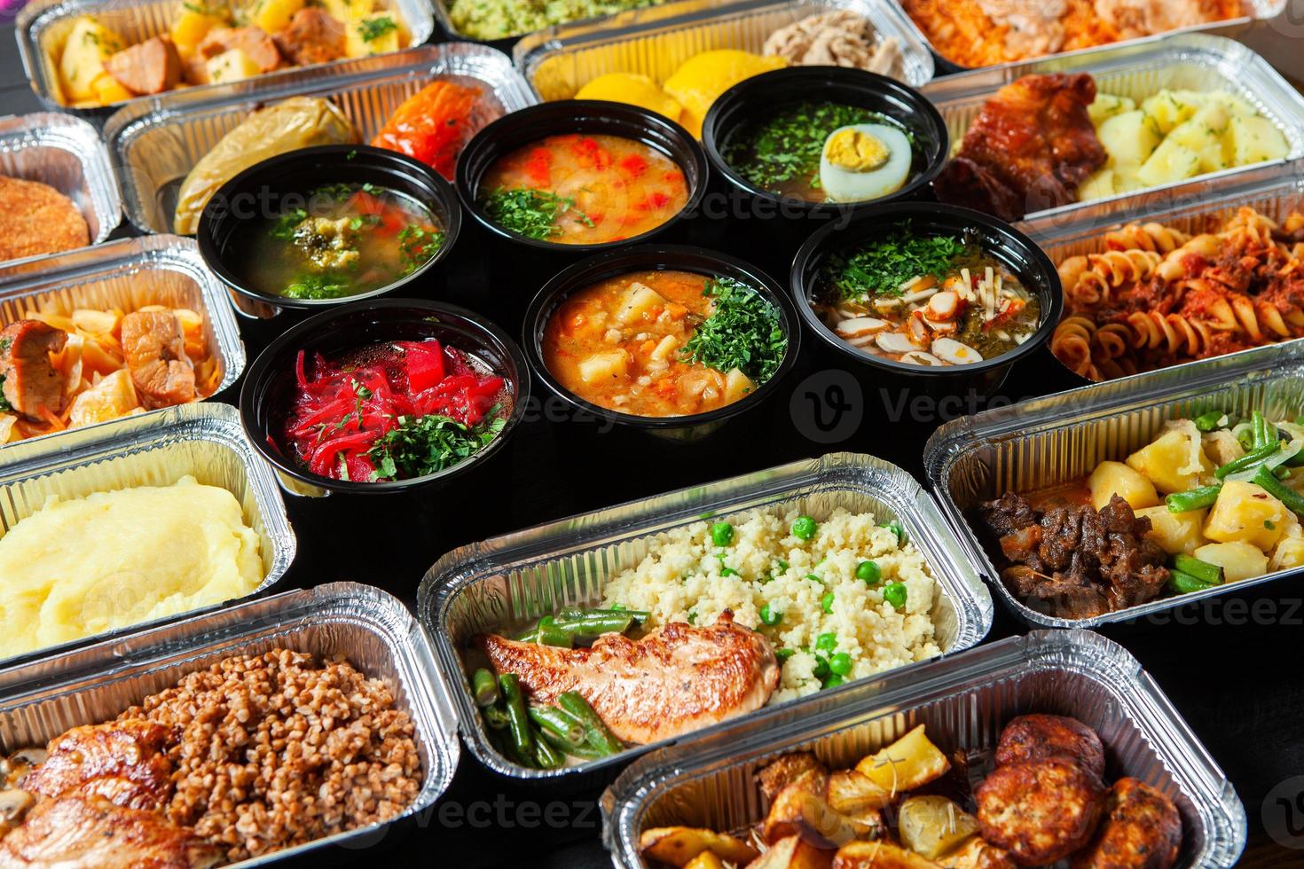 Business lunch in eco plastic container ready for delivery.Top view. Office Lunch boxes with food ready to go. Food takes away. Catering, brakfast. photo