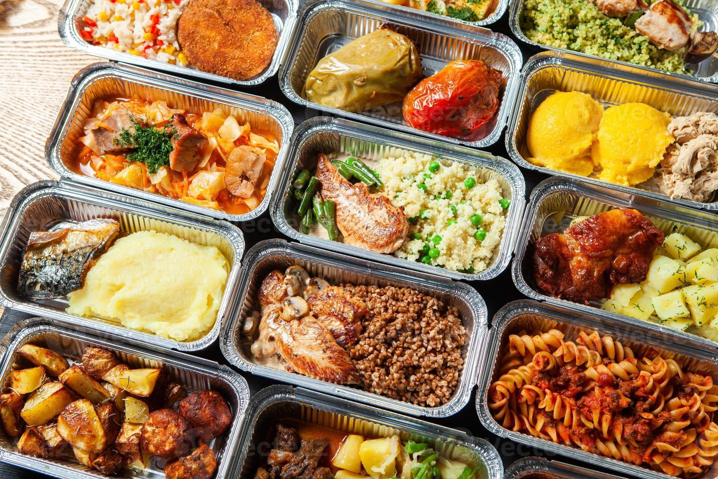 Business lunch in eco plastic container ready for delivery.Top view. Office Lunch boxes with food ready to go. Food takes away. Catering, brakfast. photo