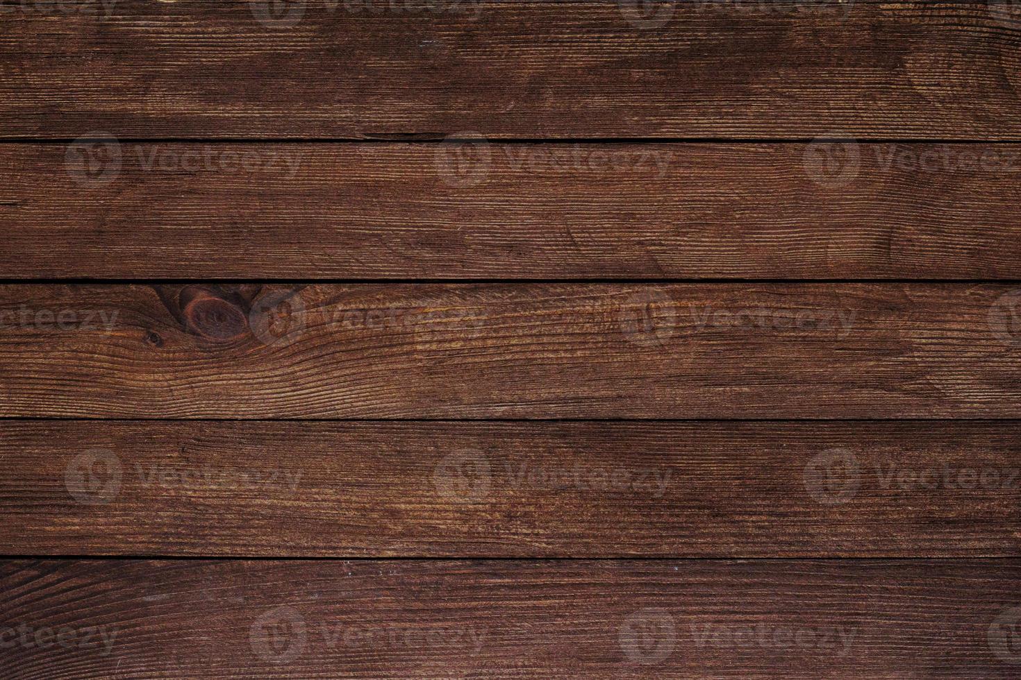 Vintage brown wood background texture with knots and nail holes. Old painted wood wall. Brown abstract background. Vintage wooden dark horizontal boards. Front view with copy space photo