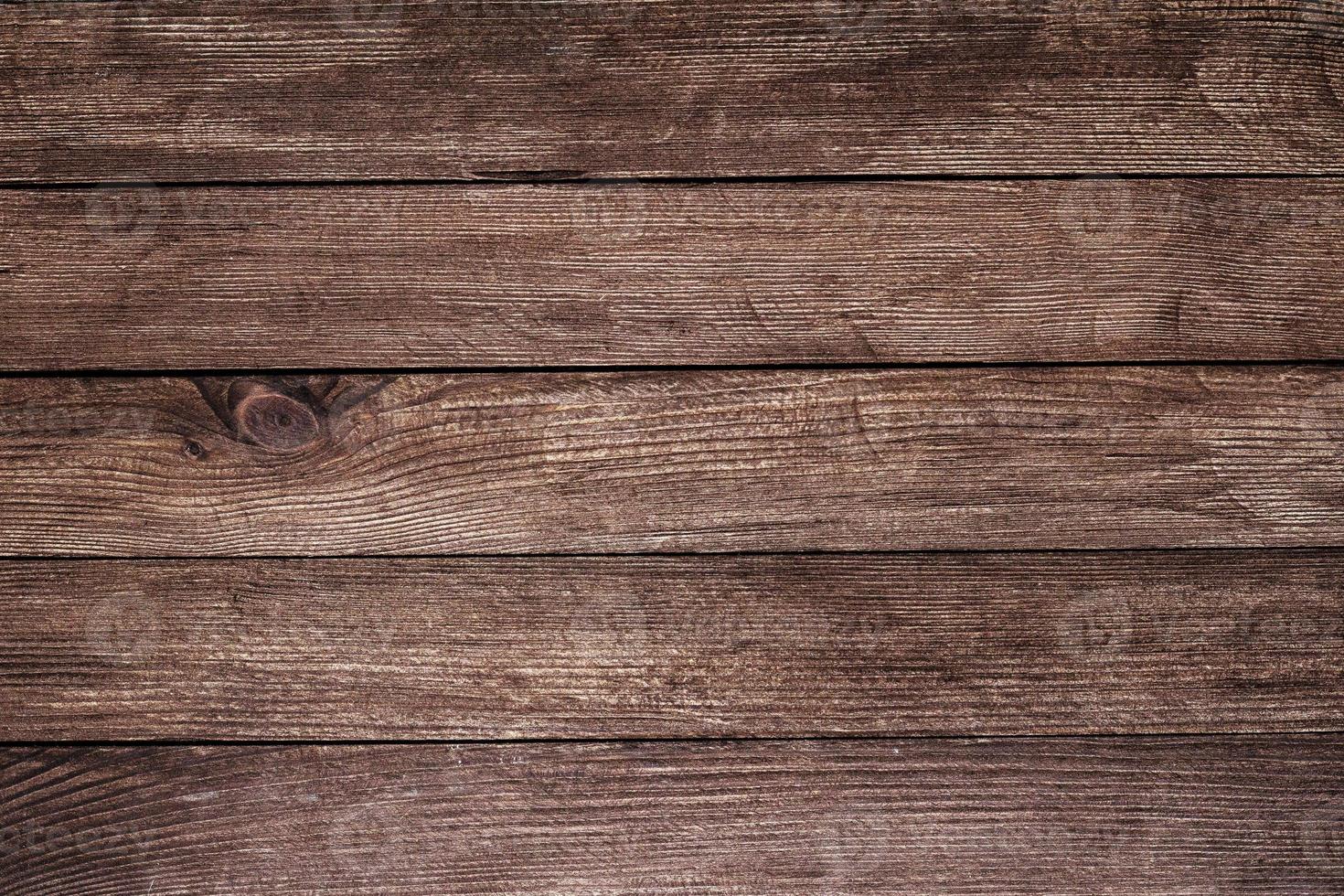 Vintage brown wood background texture with knots and nail holes. Old painted wood wall. Brown abstract background. Vintage wooden dark horizontal boards. Front view with copy space photo