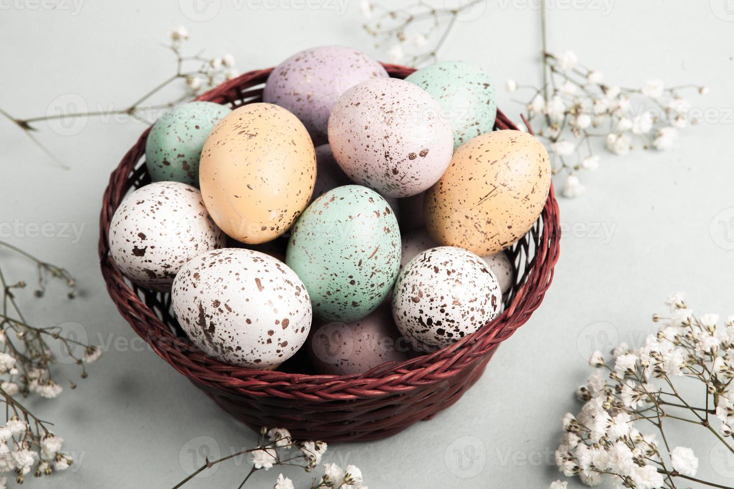 Hand painted pastel colored Easter eggs background. Happy Easter greeting card or invitation. photo