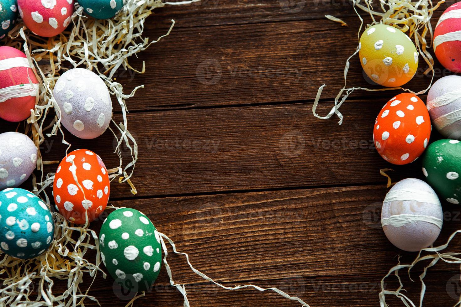 Hand painted pastel colored Easter eggs background. Happy Easter greeting card or invitation. photo