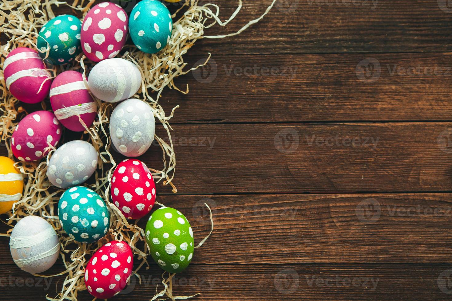 Hand painted pastel colored Easter eggs background. Happy Easter greeting card or invitation. photo