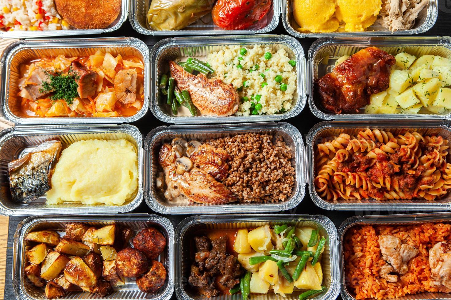 Business lunch in eco plastic container ready for delivery.Top view. Office Lunch boxes with food ready to go. Food takes away. Catering, brakfast. photo